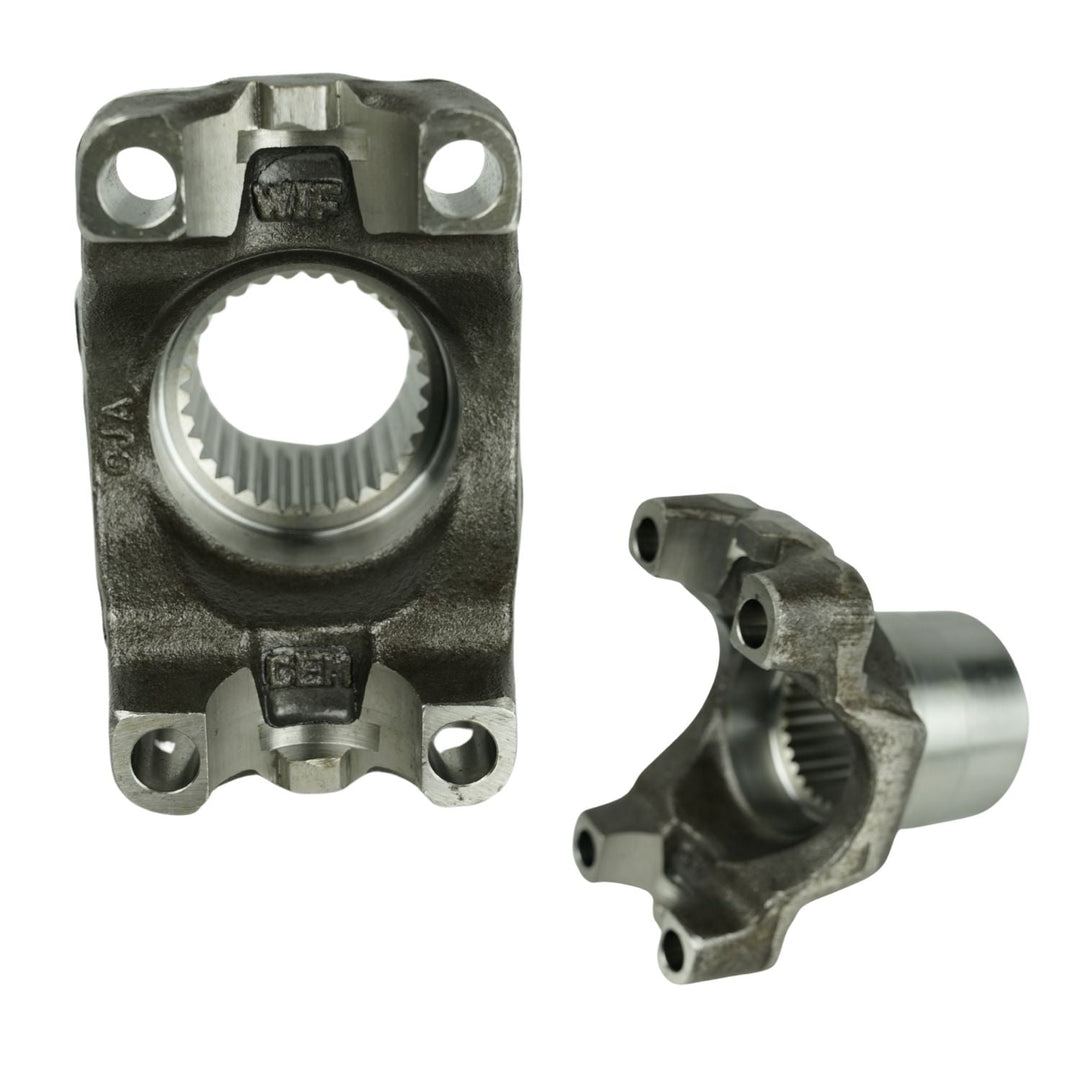 Two GM 14 Bolt forged drivetrain yokes on a white background
