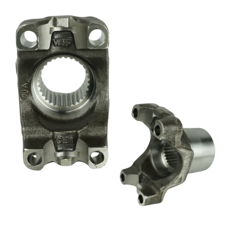 Two GM 14 Bolt forged drivetrain yokes on a white background