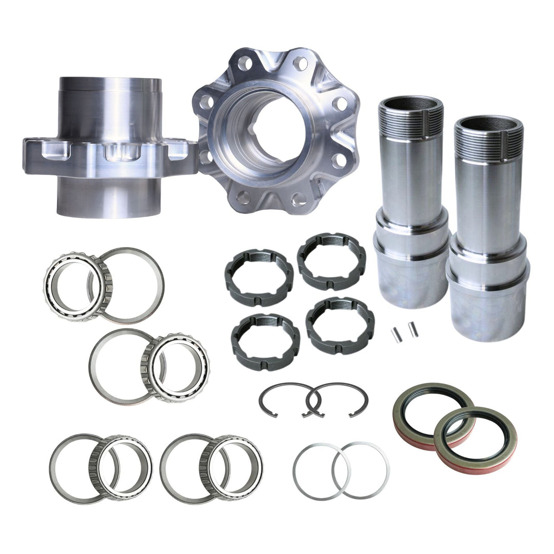 A GM 14-Bolt 40-spline spindle and hub kit arranged on a white background, including two hubs, two billet spindles, several bearing rings, bearings, spacers, and seals.