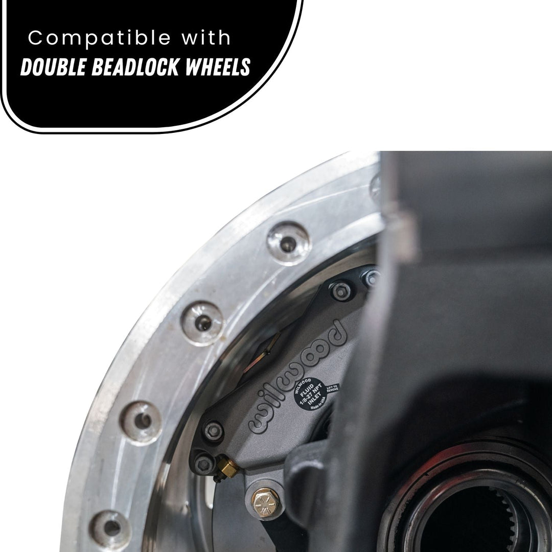 Close-up of Crane Axle Magnum Knuckle brake upgrade, text indicating compatibility with double beadlock wheels.