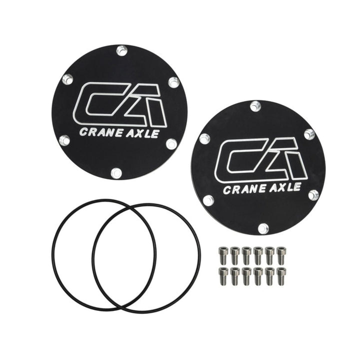 Two black Crane Axle 2005+ Super Duty unit bearing covers on a white background