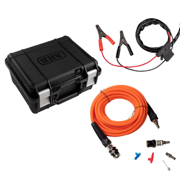 high flow portable air compressor 100 psi with jump leads, orange cable, and connectors on a white background