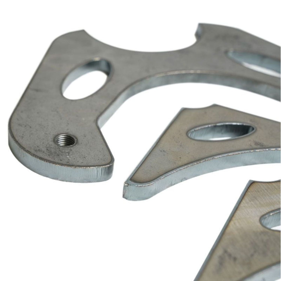 14 bolt full float disc brake conversion brackets with multiple holes on a white background