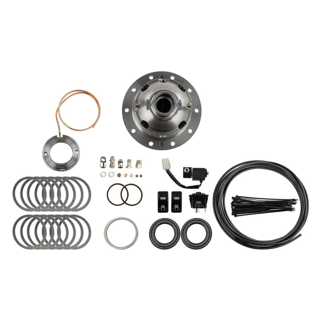 Collection of Dana 44 selectable locking differential parts and components on a white background