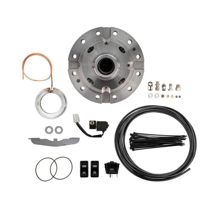 Collection of GM 14 bolt off-road locking differential parts including a metal flange, wiring harness, and connectors on a white background.