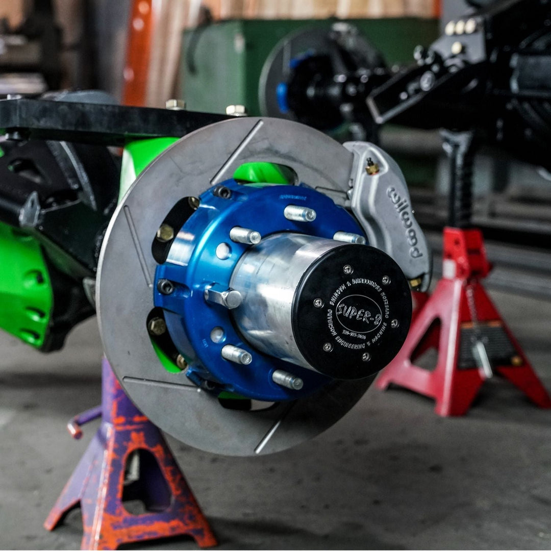 Close-up of a 14 inch Wilwood off road brake kit in a garage setting
