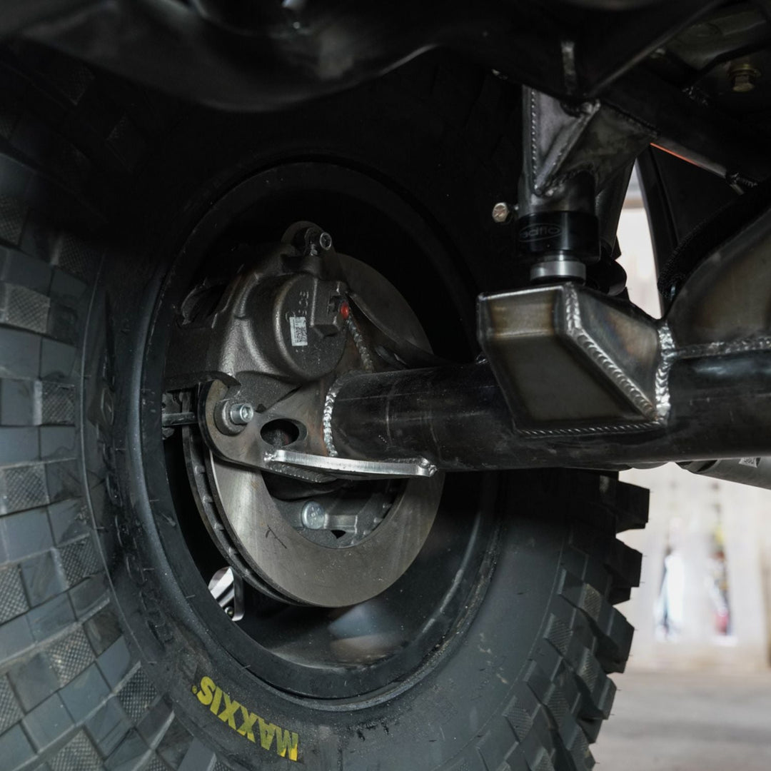 Close-up of a vehicle wheel with GM 14 bolt rear disc brake kit in use
