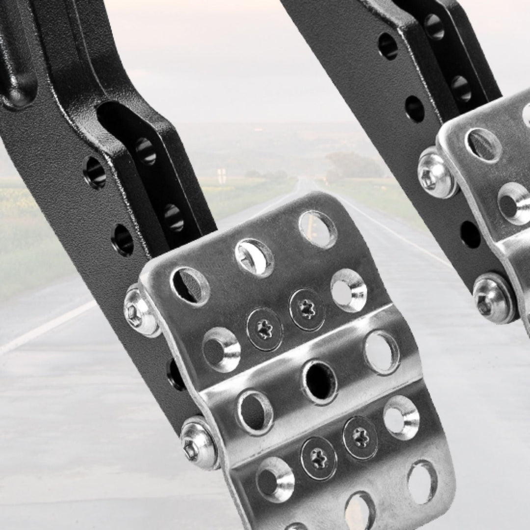 Close-up of firewall mount brake pedal assembly with screws on a light gray background